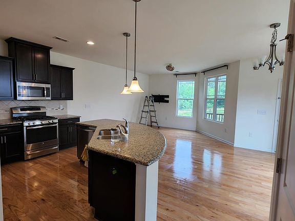Open floor plan, hardwood throughout.