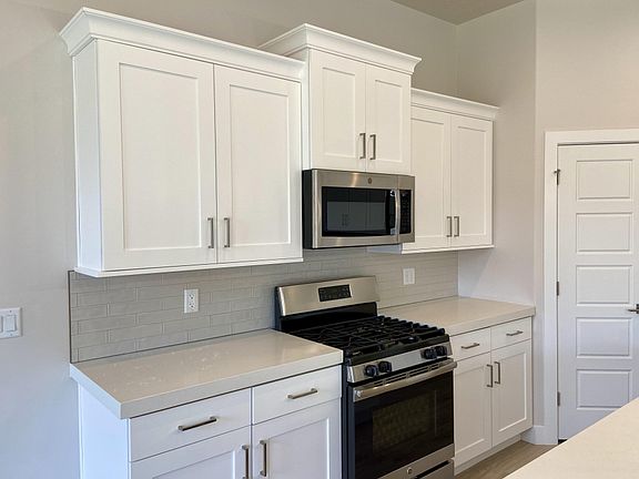 Kitchen appliances range, microwave and dishwasher