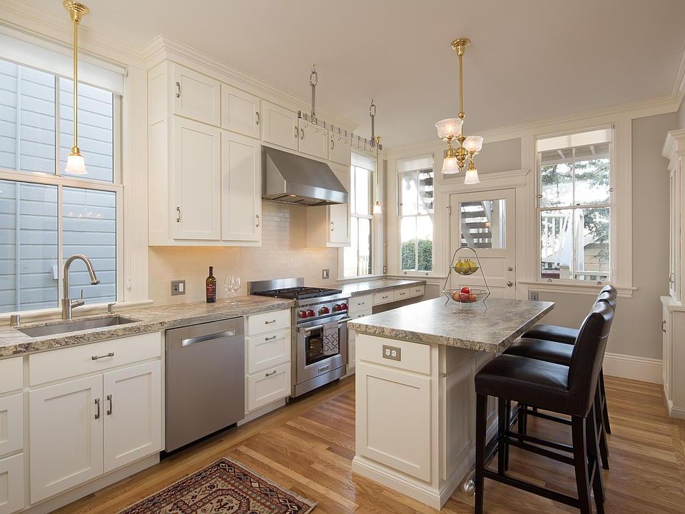 Chef's Kitchen with Wolf Range (nice large oven and 4 gas burners), quiet Bosch Dishwasher, large KitchenAid refer w/ ice, breakfast/dining counter at center island.