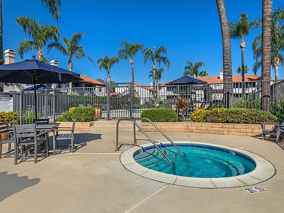 Sedona Apartments in Moreno Valley feature a renovated pool deck with a Jacuzzi and covered patio tablesperfect for relaxing or socializing in style.