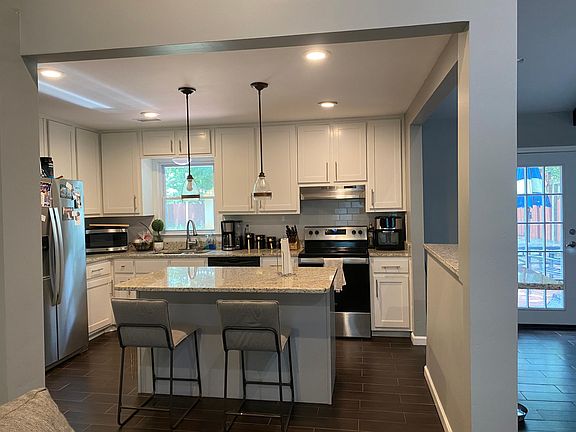 Updated kitchen with granite countertops and island