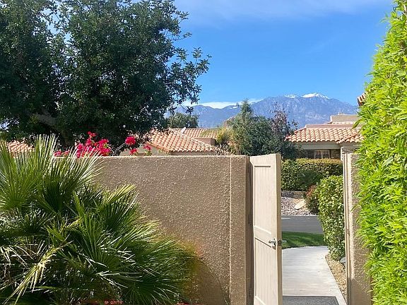 Private front gate to side yard and front door.