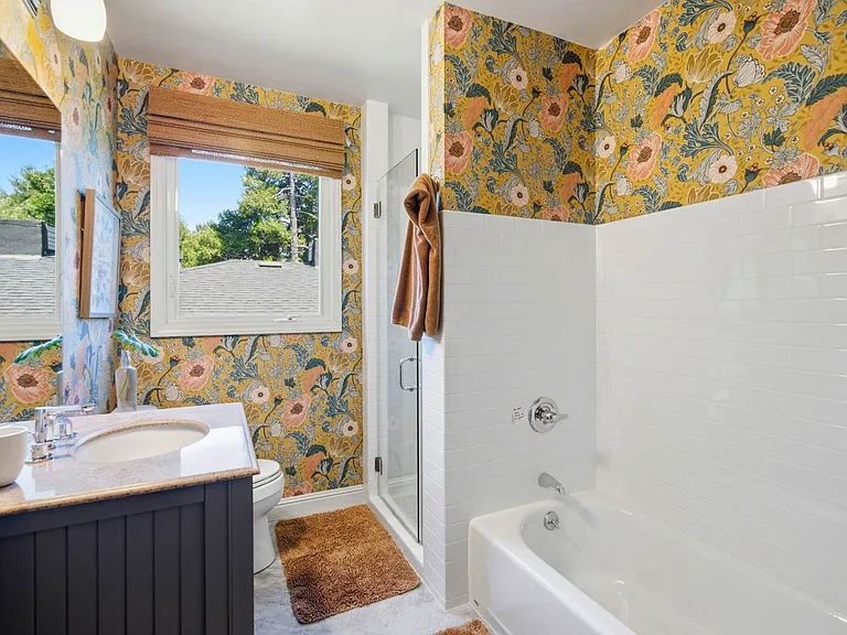 This bathroom is on the main floor and has a separate tub and shower.