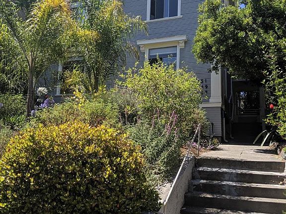 Street view of duplex. Landscaping professionally created and maintained.