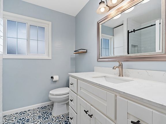 Remodeled Full Bath with Tub and Shower overhead