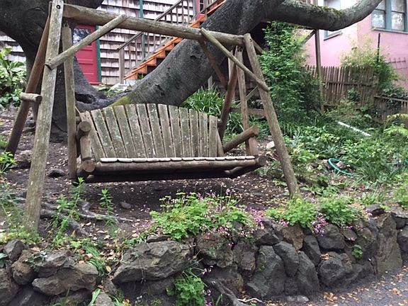The old porch swing in yard
