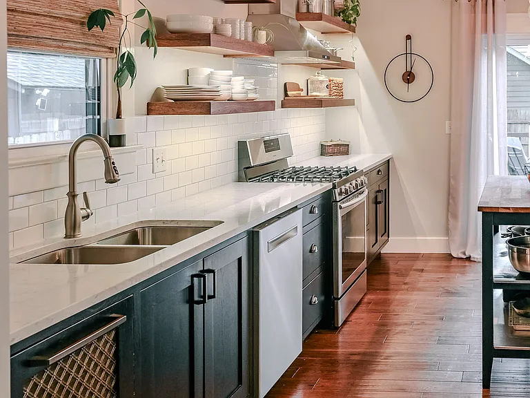 Gas range and custom wood cabinets.