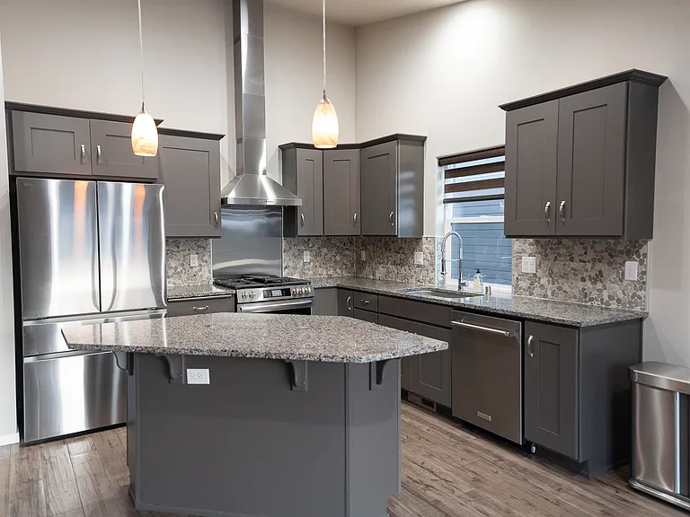 All stainless steel appliances including a brand new sink and a faucet