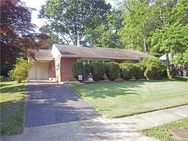 Nice Ranch home with carport and trees