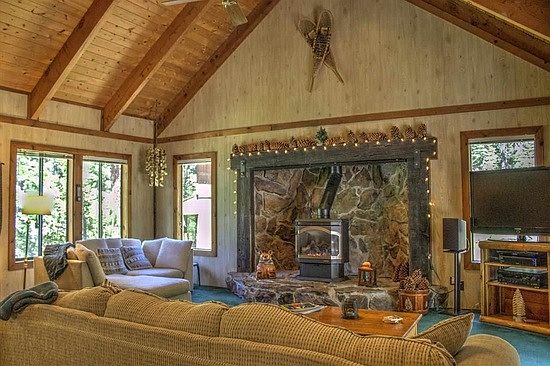 Living area with fireplace and vaulted ceiling