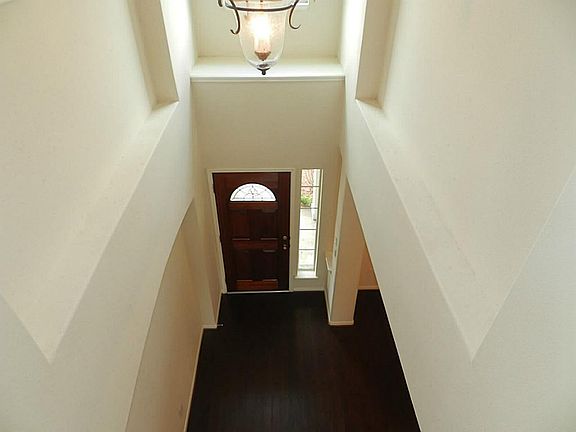 A view of the entry from the top of the stairs.