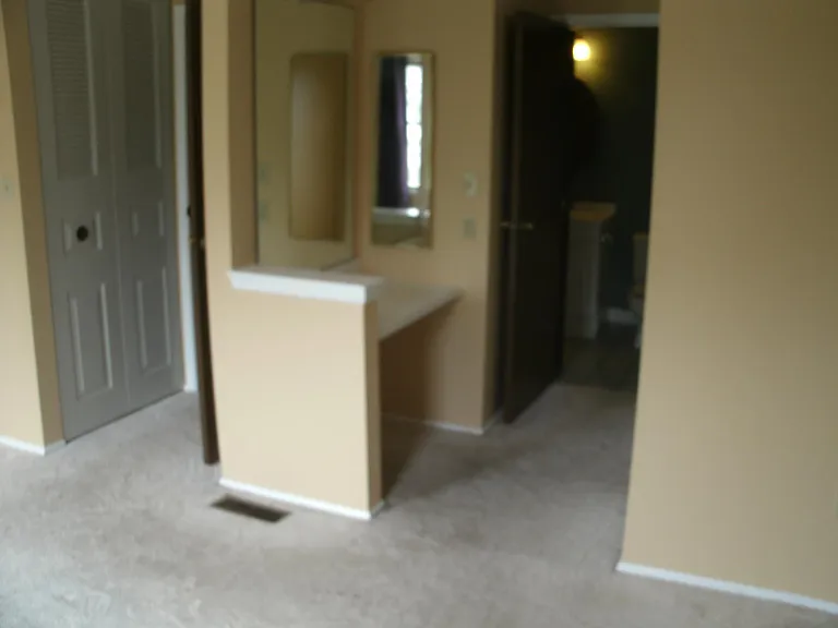 Convenient Vanity in master bedroom, with Mirror and cabinet.