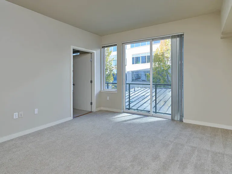 Carpeted Living Room with Juliet Balcony