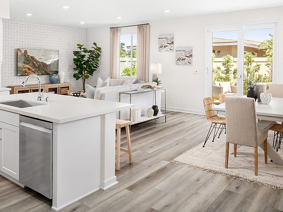 Model home open concept great room connecting living, dining, and kitchen areas