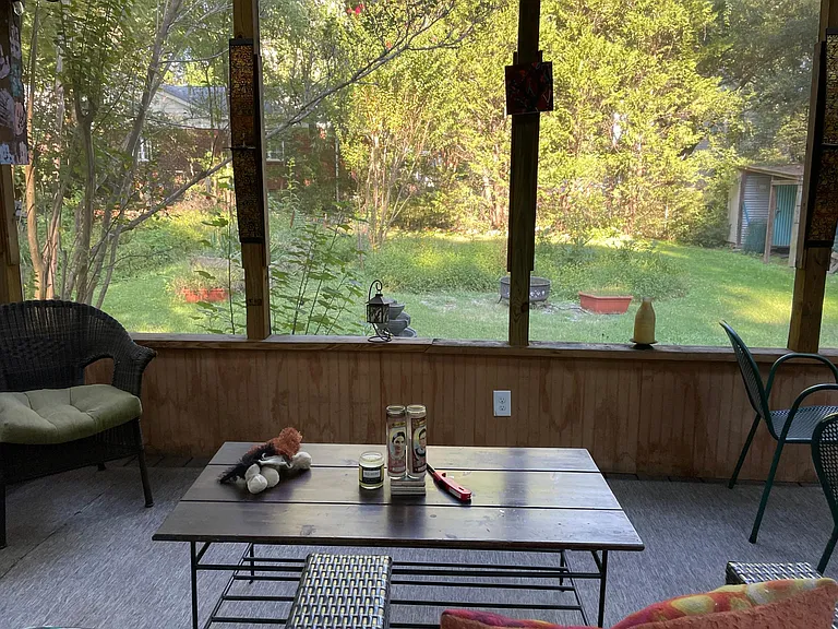 Fully screened in porch to private back yard
