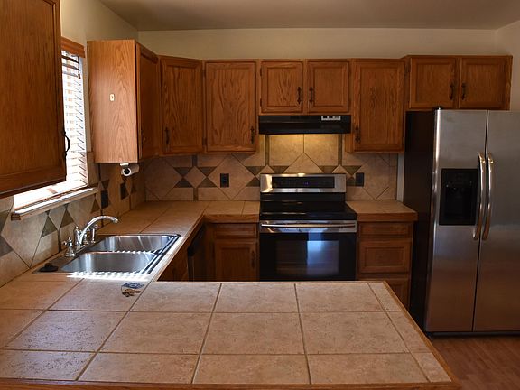 Kitchen complete with stainless steel appliances.