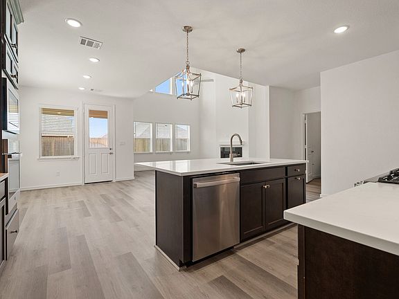 Kitchen with seamless flow to dining area great room