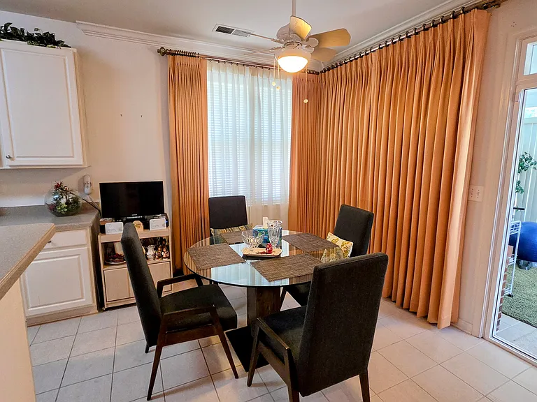 Charming, sunlit breakfast nook right off the kitchen_ideal for your morning coffee or casual weeknight meals.