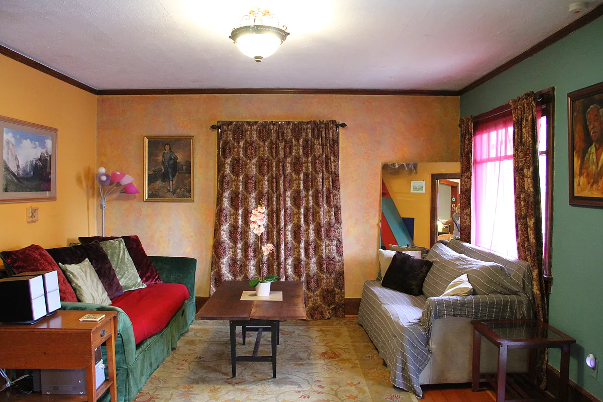 Comfy living room with large picture windows. - 3964 N Michigan Ave #B