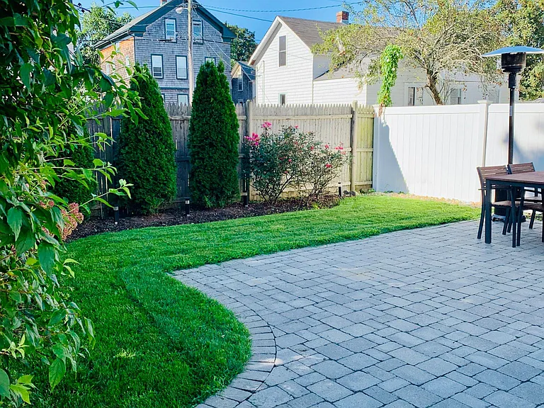 fenced yard and patio with grill