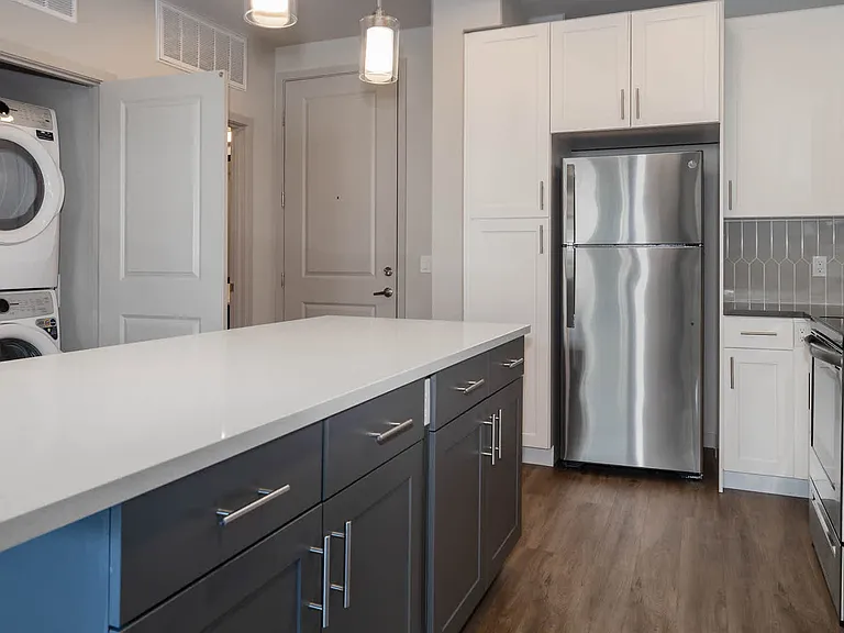Kitchen with Stainless Steel Appliances and In-home Washer and Dryer