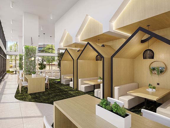 Coworking spaces include comfortable seating areas and private workstations, catering to residents' diverse work needs.