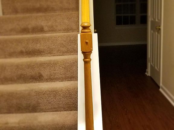 Entrance, steps going upstairs / hall going into living / d