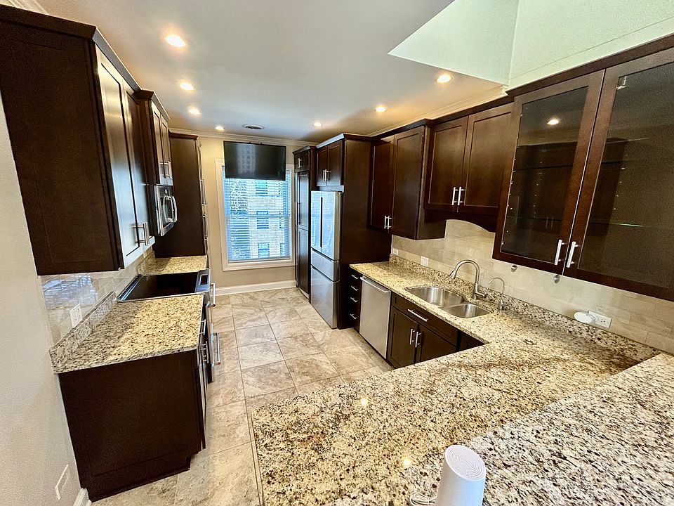 Recessed lighting, skylight, granite countertops and terrazzo tile floors