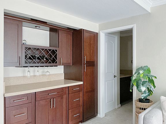 Built-in mahogany wine rack & cabinets, Storage Room in Hallway