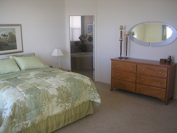 Master Bedroom w/ Deck Access and Coffered Ceilings