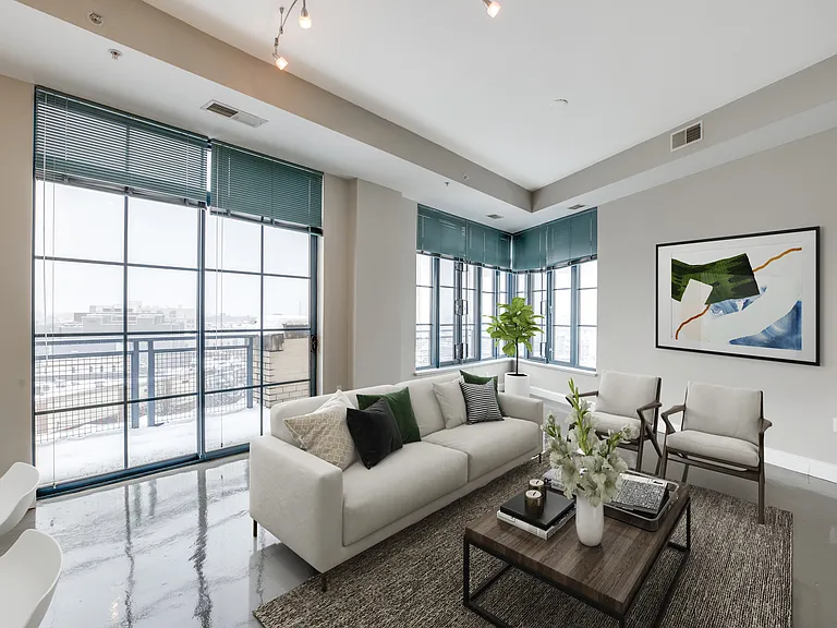 Living room with 10-foot ceilings with city views