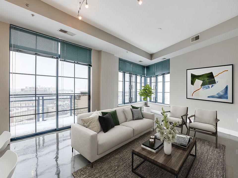 living room with floor to ceiling windows