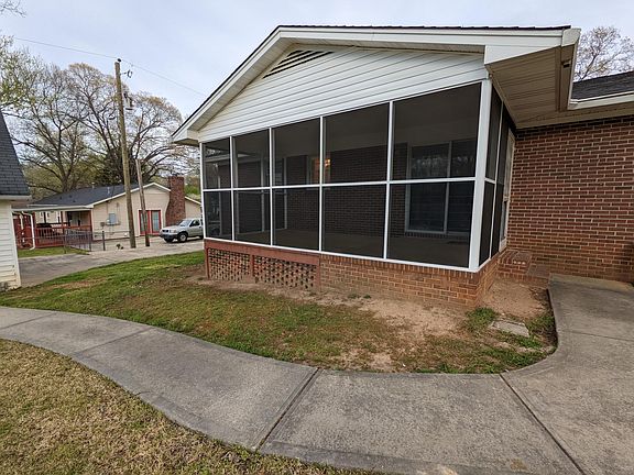 Screened porch, 2nd driveway and sidewalk to detached garage.