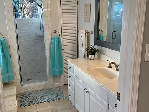 Full size shower, plus more storage for linens.