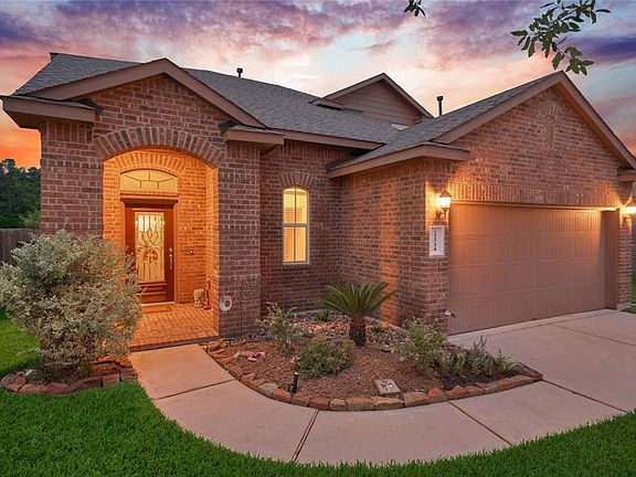 Charming walkway leads you and your guest to your beautiful covered front porch with upgraded leaded glass front door!