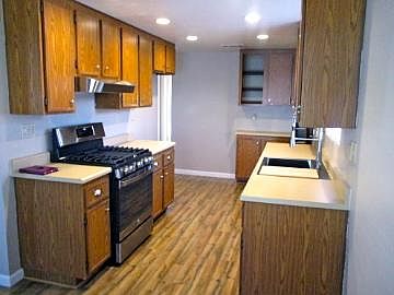 Kitchen with new stove and farmhouse sink