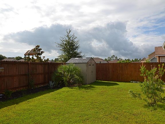 Back yard with extra storage shed.