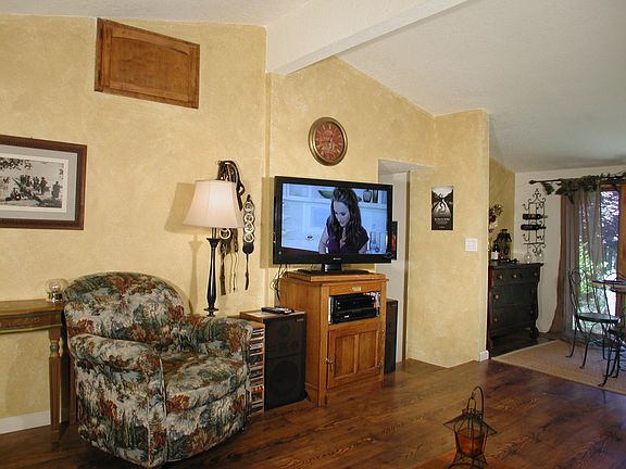 Living area open to dining area, previously furnished example, wired for Dish Network, own DVR receiver currently in place for extra $60 monthly.