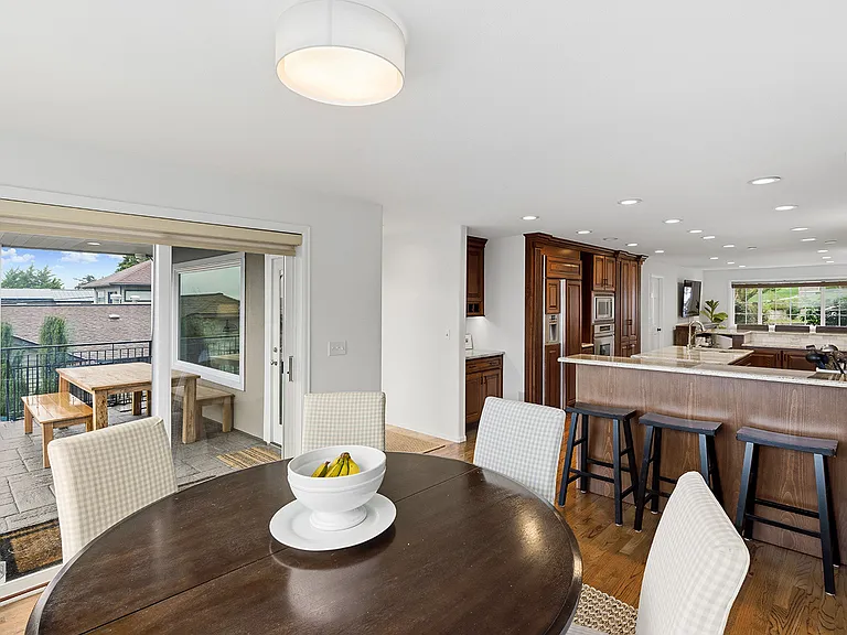 Formal Dining Room, open to Kitchen, Living Room and Family Room, with door to outdoor Dining area