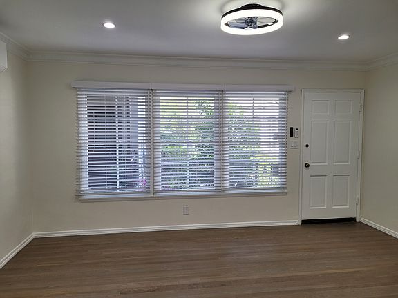 View of living room from breakfast nook. Lovely view of the quiet and relaxing courtyard!