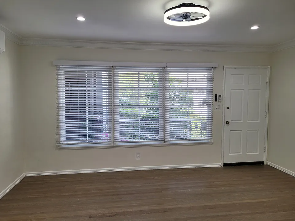View of living room from breakfast nook. Lovely view of the quiet and relaxing courtyard!