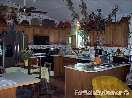 Kitchen : Hanging feature top right does not stay, family heirloom.