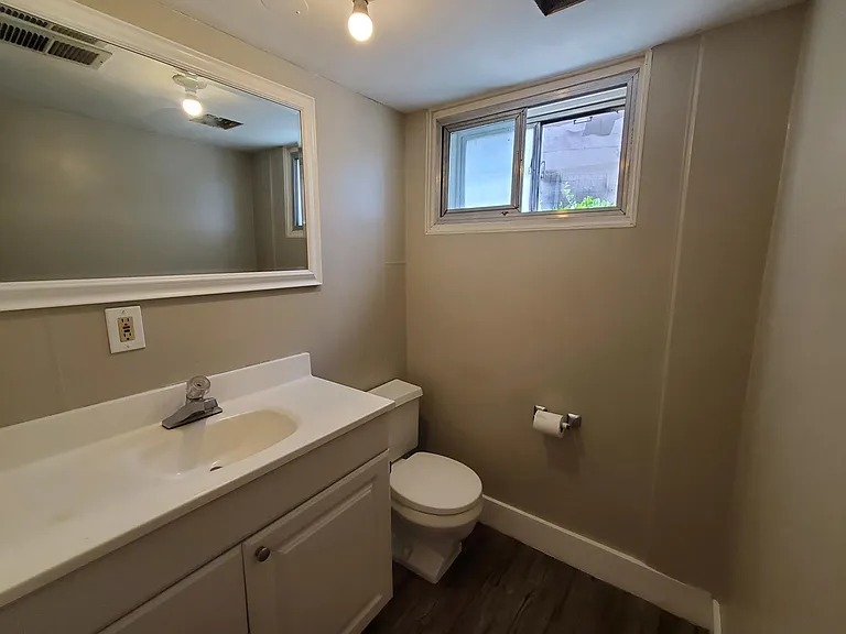 Bathroom. Large vanity and mirror.