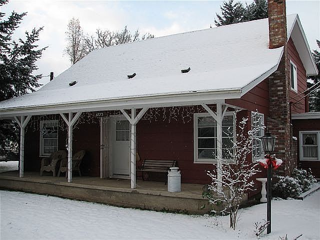 Front porch entrance with light & lilac tree