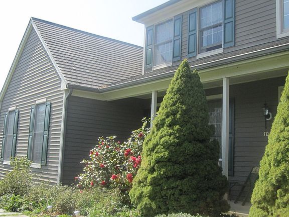 Lovely landscaping and flowering shrubs abound.