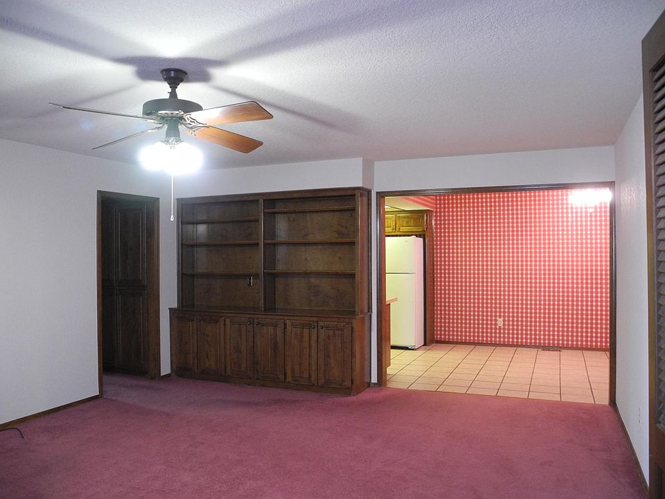 View from front room to eating area. Wall paper has been removed and wall painted