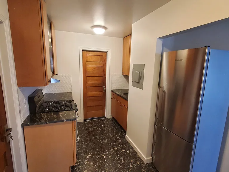 Kitchen and left door is 3 bedroom with walking closet
