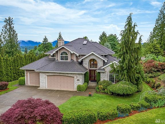  Private and Peaceful setting in the premier Shadow Ridge neighborhood with views of Tiger, Cougar & the Cascade Mountains and a level professionally landscaped .75-acre lot with smart sprinkler system. This 2-story home with a full basement is the one to see! 
