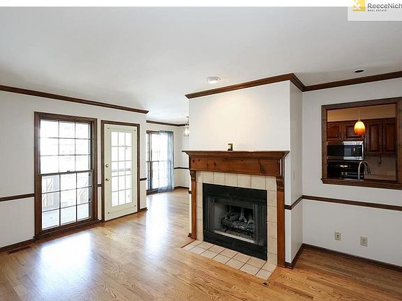 Living room with deck access - looking into kitchen and dining room