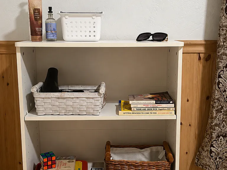 Vanity area with hairdryer, games, books and extra blanket